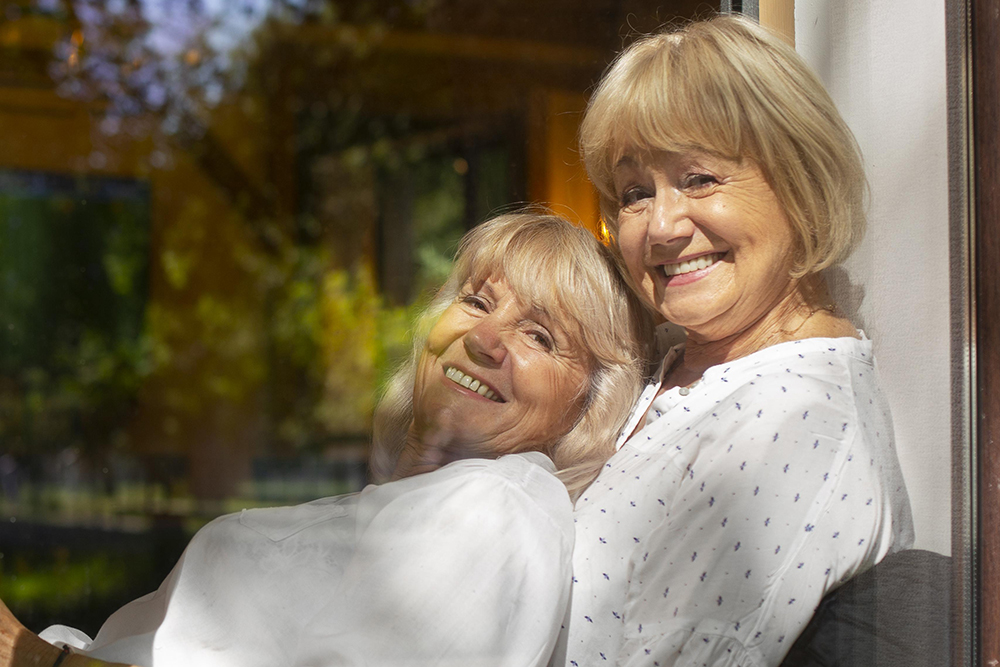 Smiling women sitting together