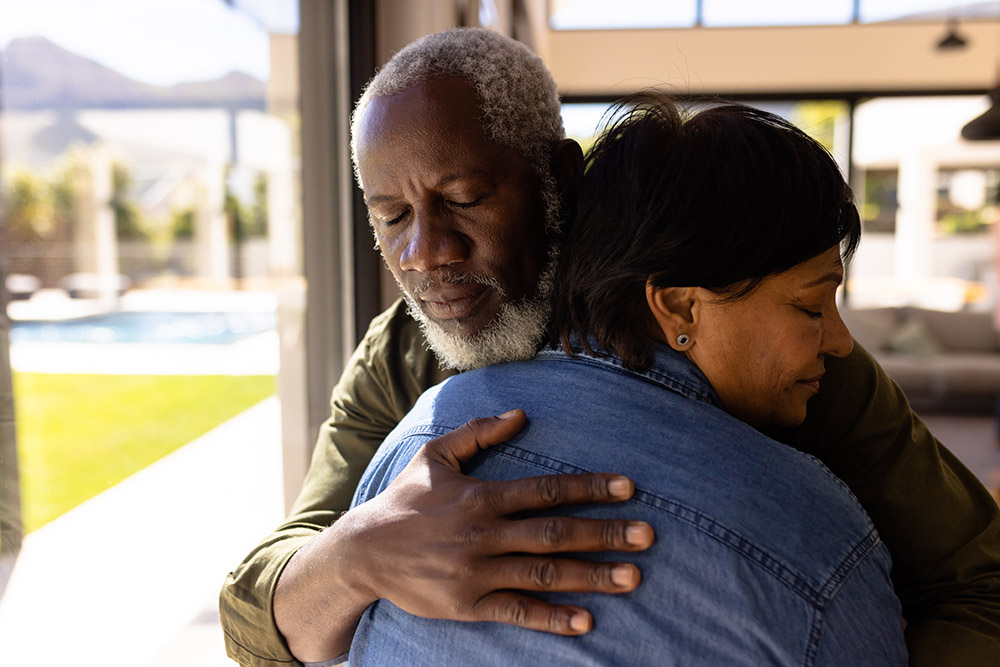 picture of man hugging younger woman